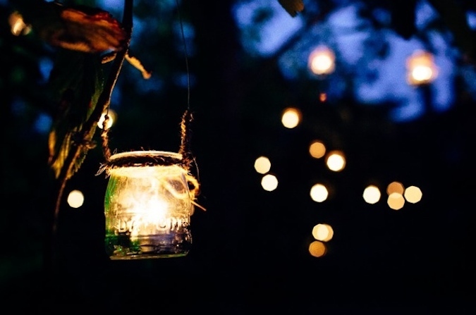 Candles in jars - area around our marquee. www.camelotmarquees.co.uk