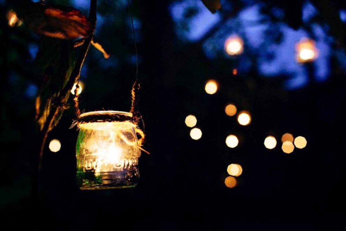 Candles in jars - area around our marquee. www.camelotmarquees.co.uk